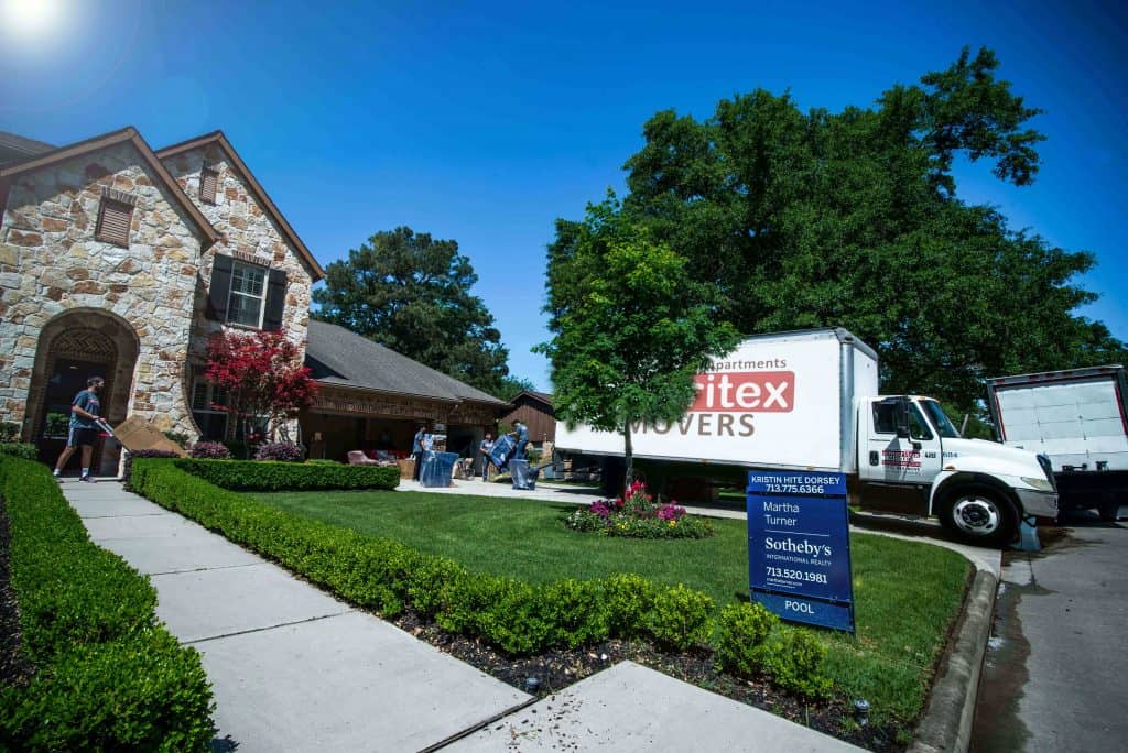 our equipment - ameritex moving truck outside home